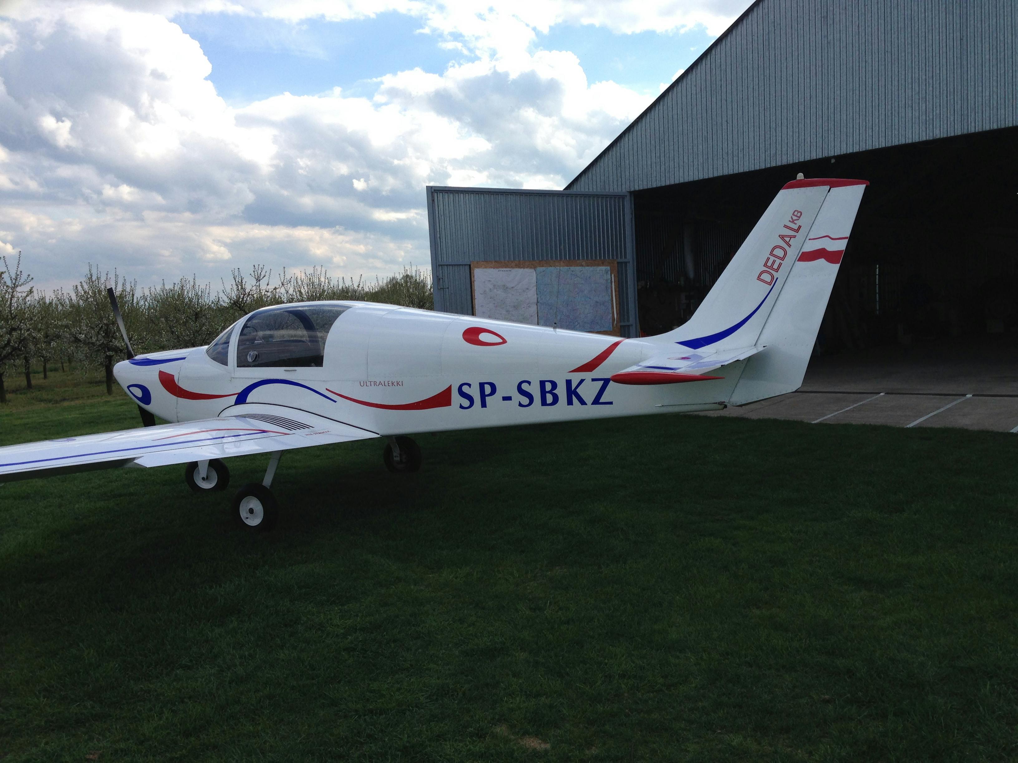 Chojeński, 2014. The DEDAL airplane at the Chojeński Airfield, standing in front of the main hangar.